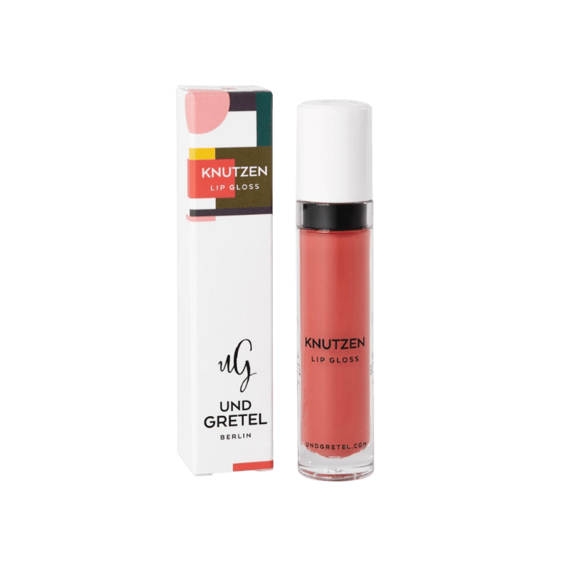 UND GRETEL KNUTZEN Lip Gloss 01 Matte Apricot, Verpackung und Flasche, auf weißem Hintergrund.