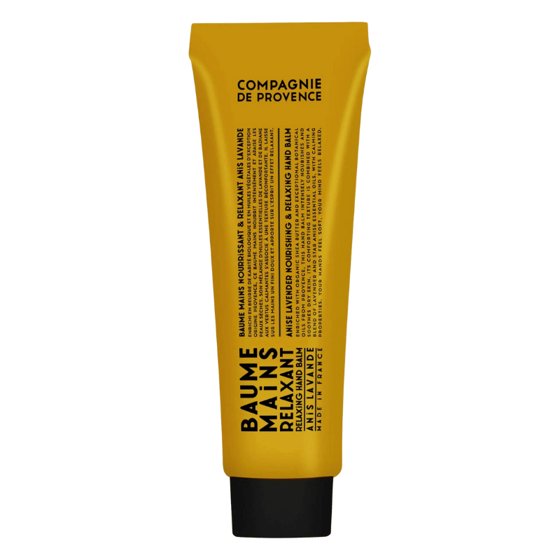 Gelbe Handcreme-Tube mit schwarzem Deckel, Aufschrift 'Baume Mains Relaxant Anise Lavender' von Compagnie de Provence.
