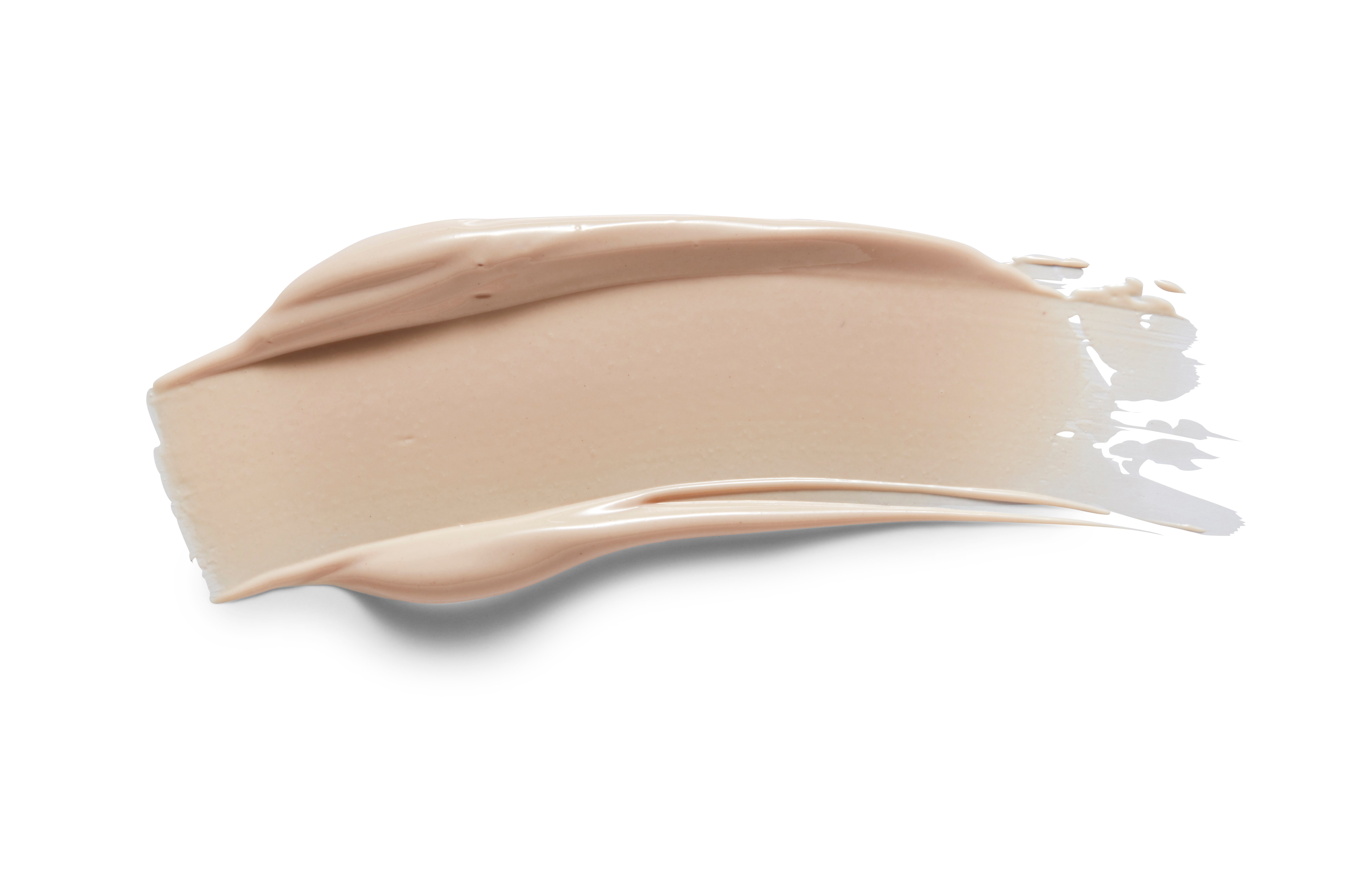 Beige Creme-Make-up auf weißem Hintergrund.