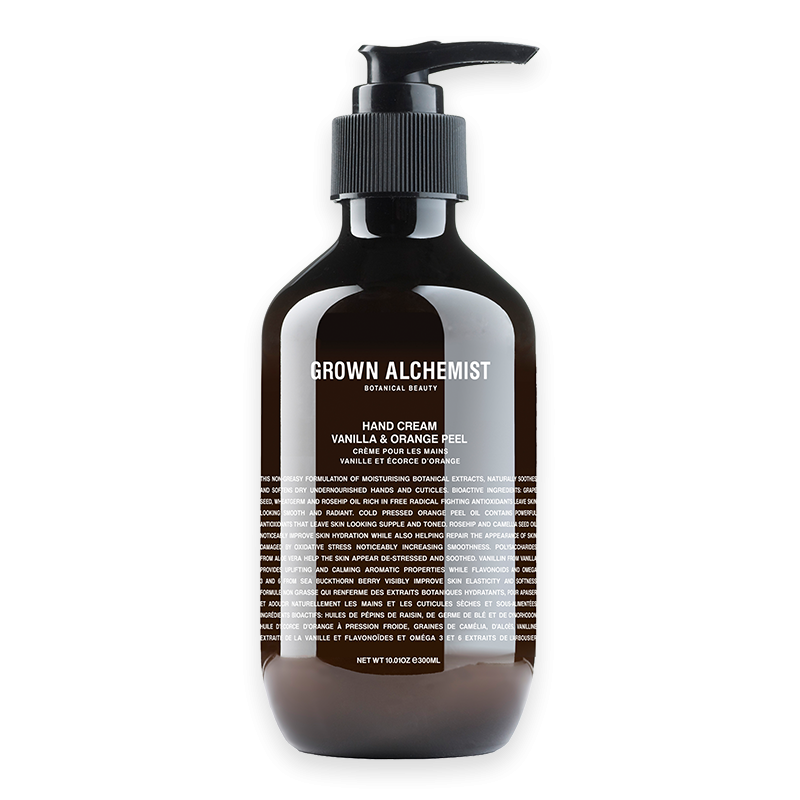 Handcreme 'Vanilla & Orange Peel' von Grown Alchemist, 300 ml, in einer braunen Flasche mit Pumpspender.