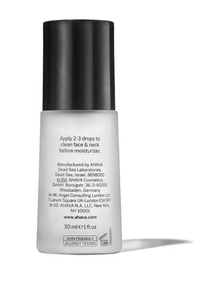 Eine Flasche AHAVA-Serum mit schwarzem Deckel und Anweisungen zur Anwendung auf der Vorderseite.